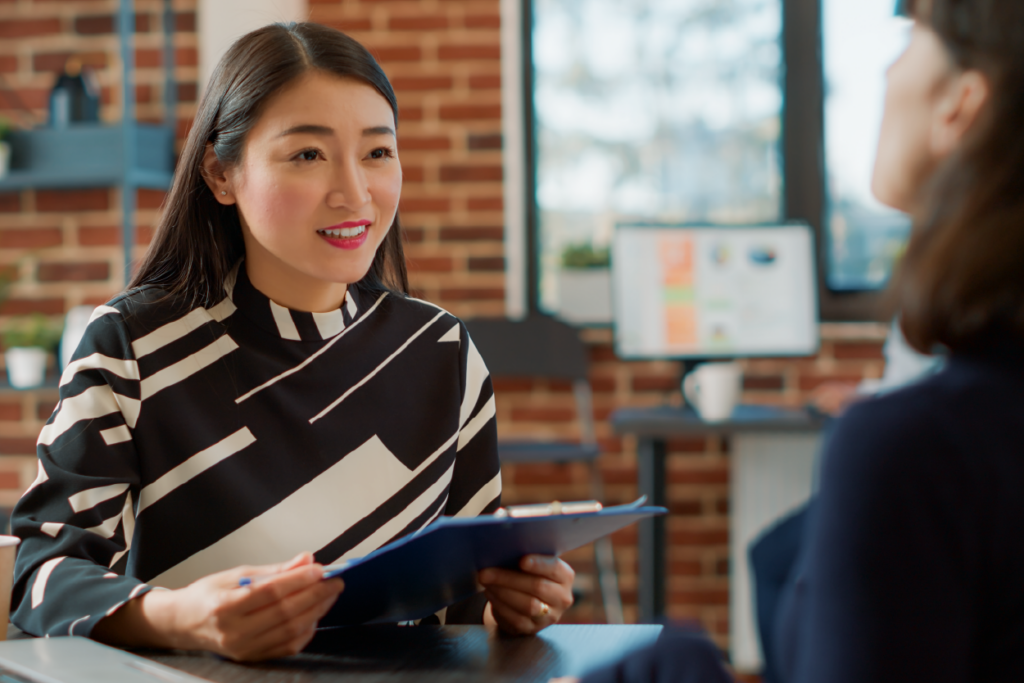 a professional marketing officer women facing her client HR for a interview