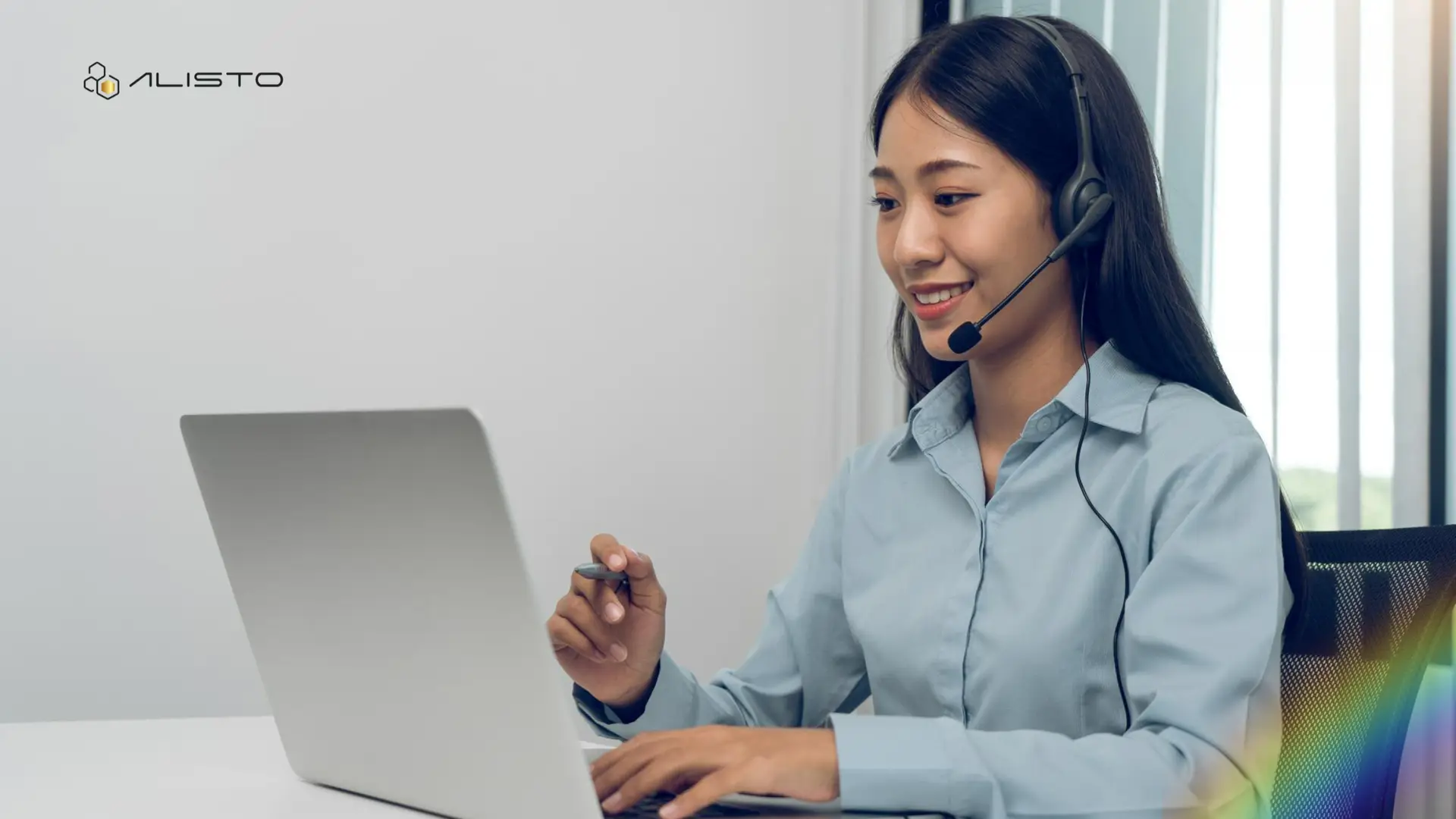 a call center agent facing his laptop on a headset in an interview position
